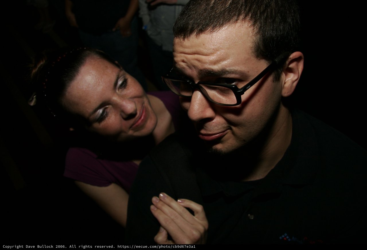 Nightclub Candid: Two Friends Share a Moment