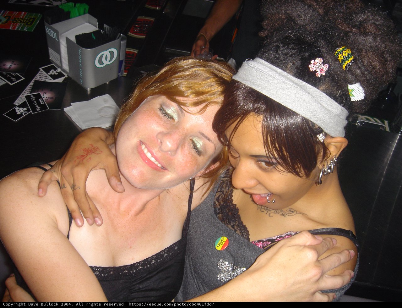 Two Friends Embracing at a Late Night Party