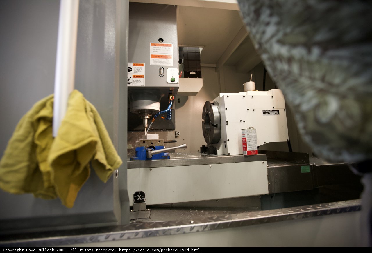 Factory Worker Operating a Lathe Machine