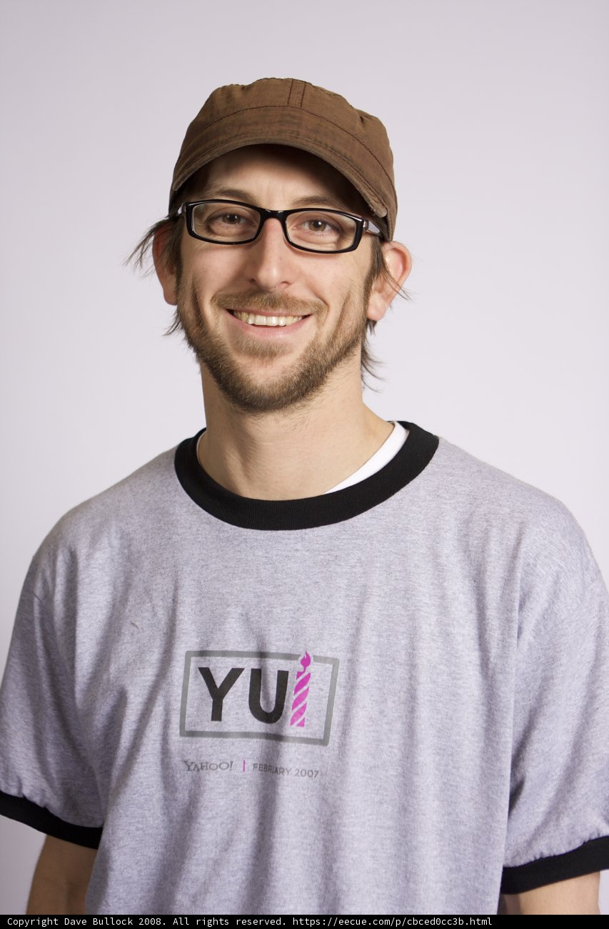 Happy Man in Grey T-Shirt and Cap
