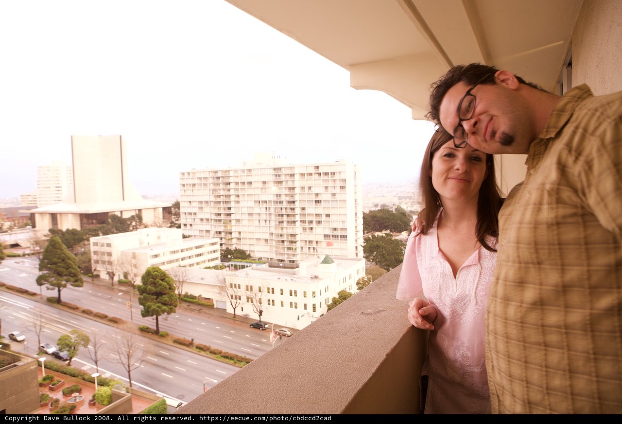 Couple Sharing a Tender Moment on City Balcony