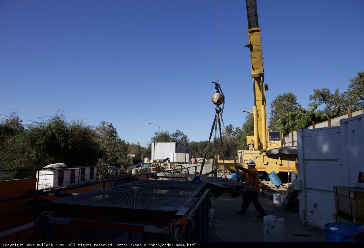 Construction Crane Lifting Large Object Over Site
