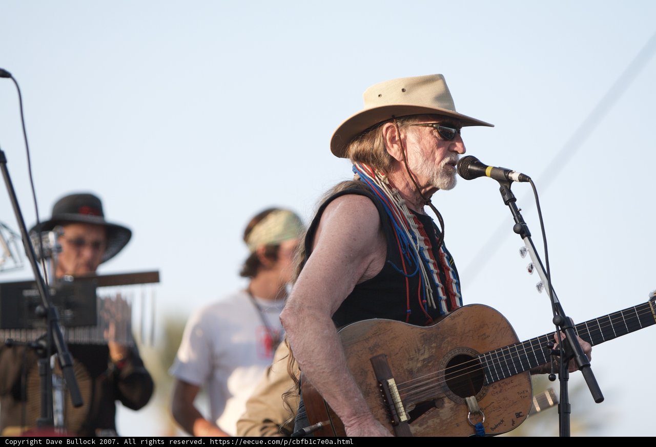 Willie Nelson strums his guitar at Coachella 2007