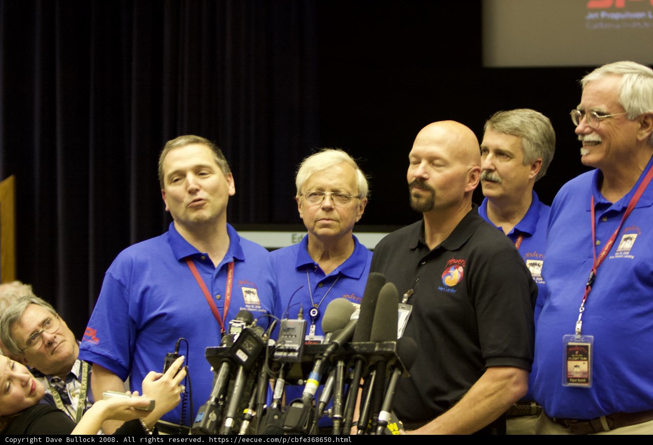 Blue-Shirted Men Address Press Conference
