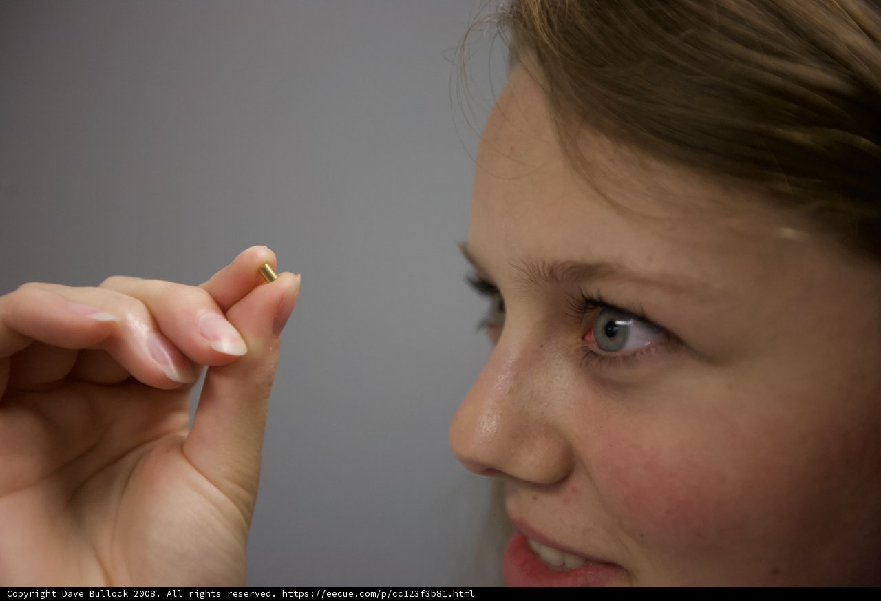 Woman holding a small object