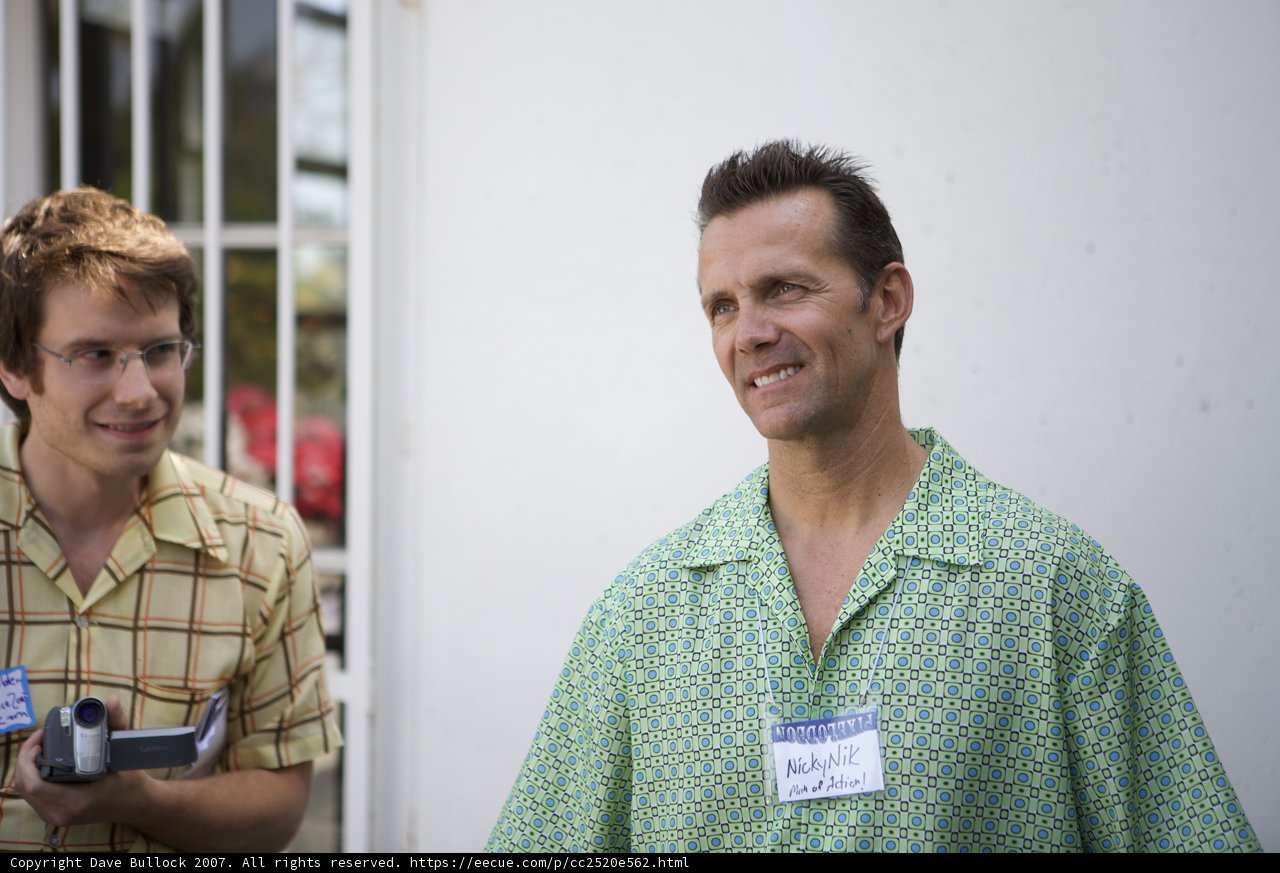 Two Happy Men in Green Shirts