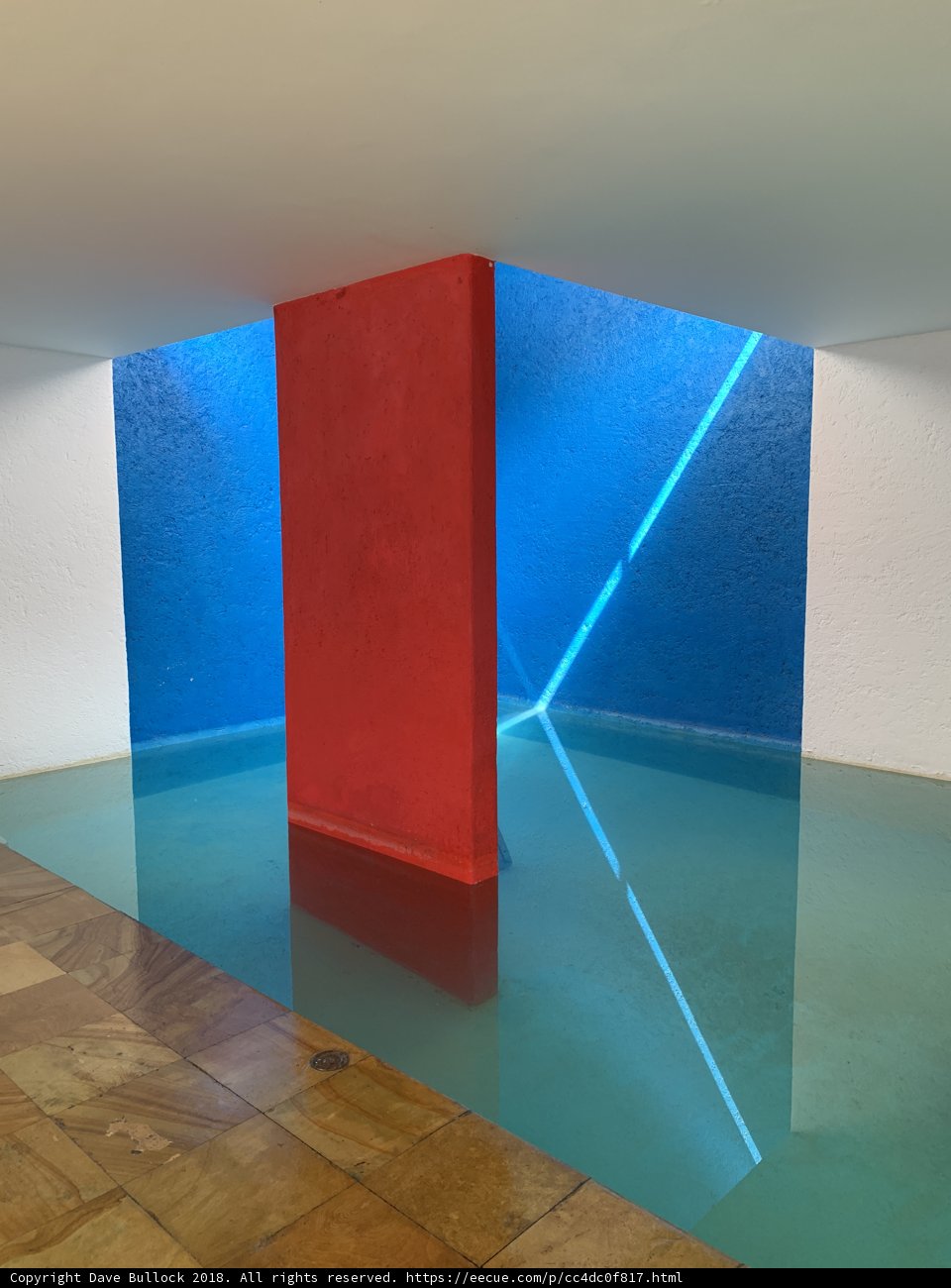 Red and Blue Wall with Water Fountain