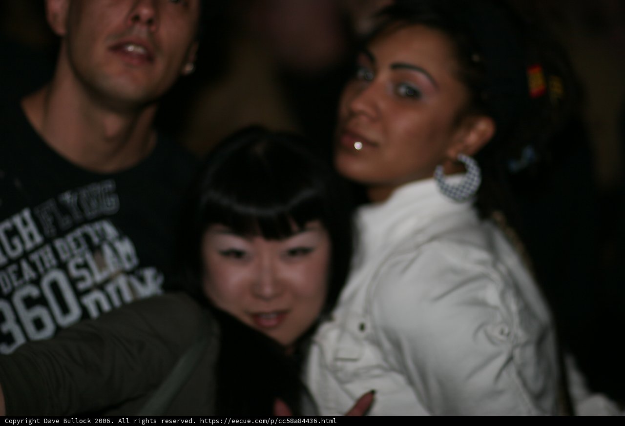 Woman with Black Hair Rocks the Night Club Scene with Friends