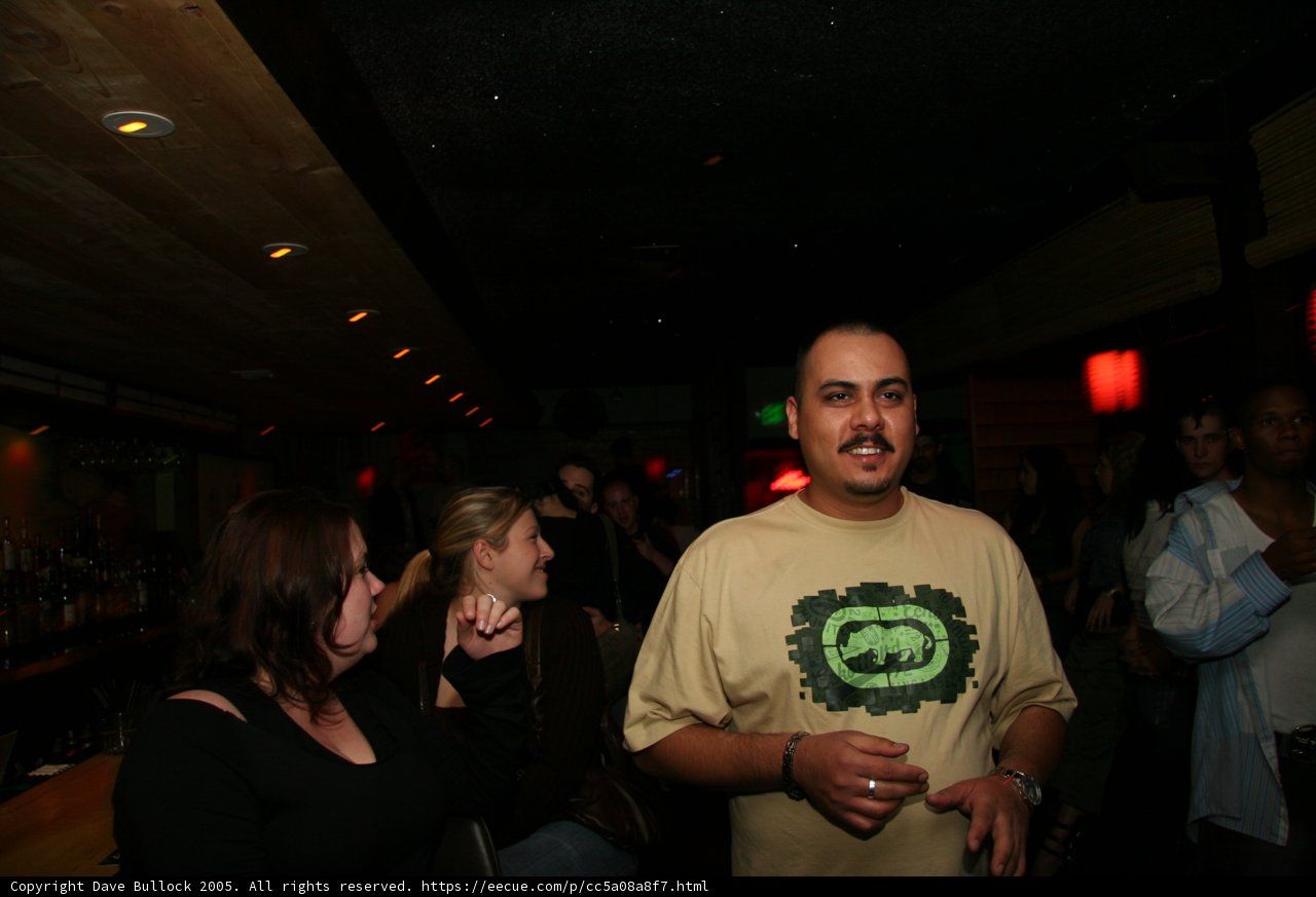 Man in Yellow Shirt at Nightclub