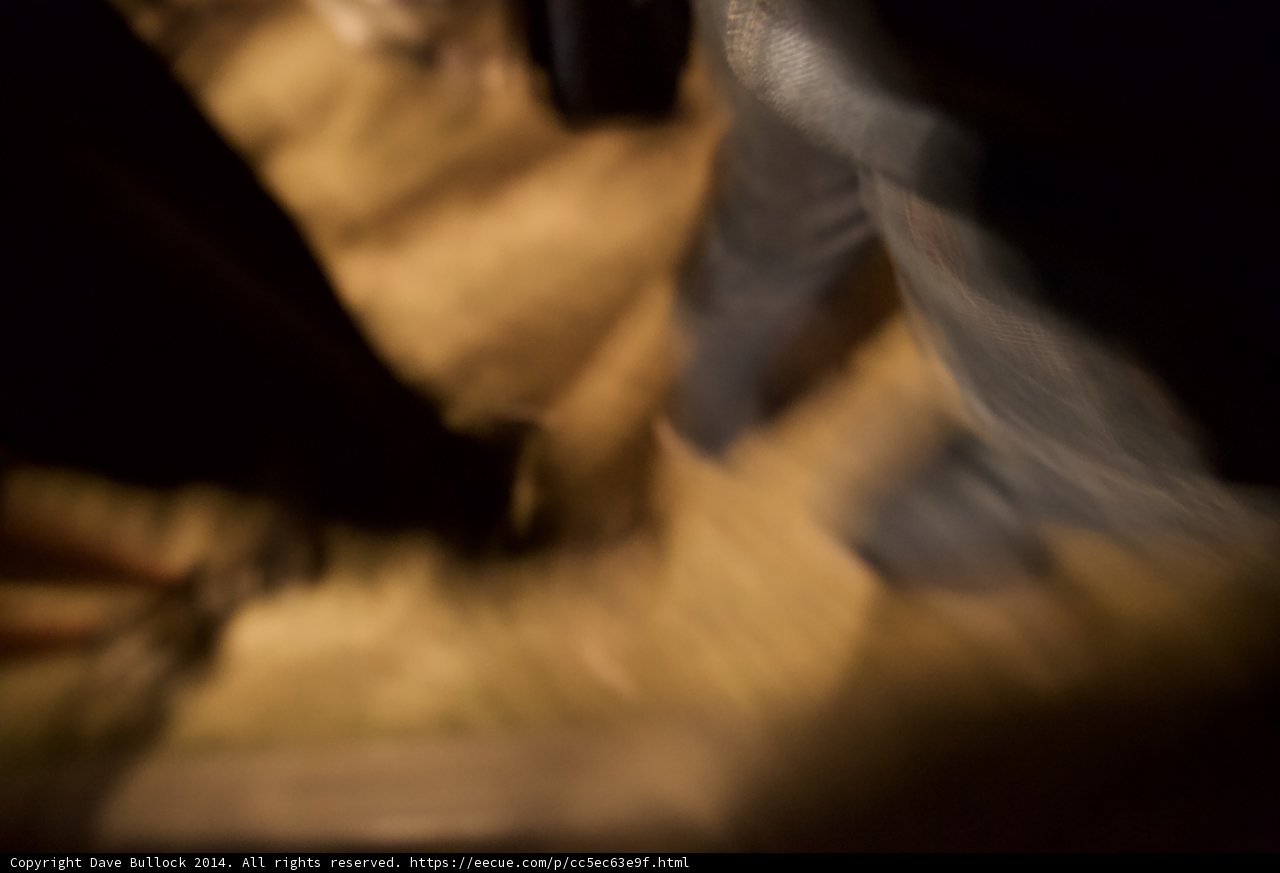 Blurred Bride Walking Down a Wooden Staircase