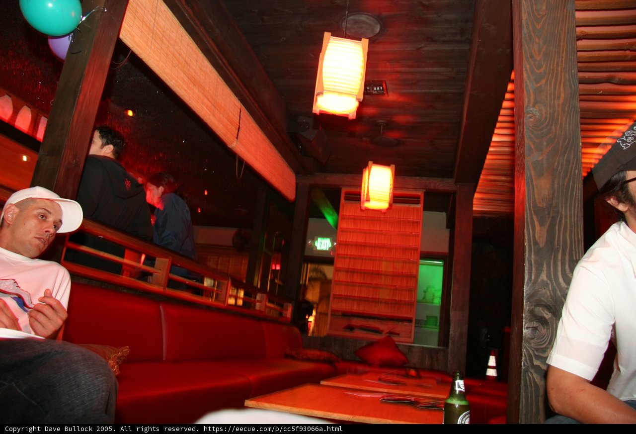 Hat-clad Dj S lounges in cozy pub