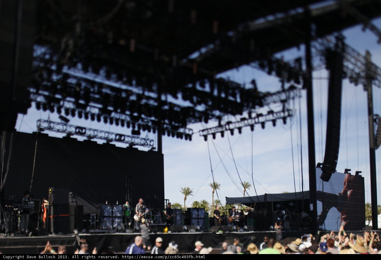 Concert Crowd Rocks Out Under Cloudy Sky