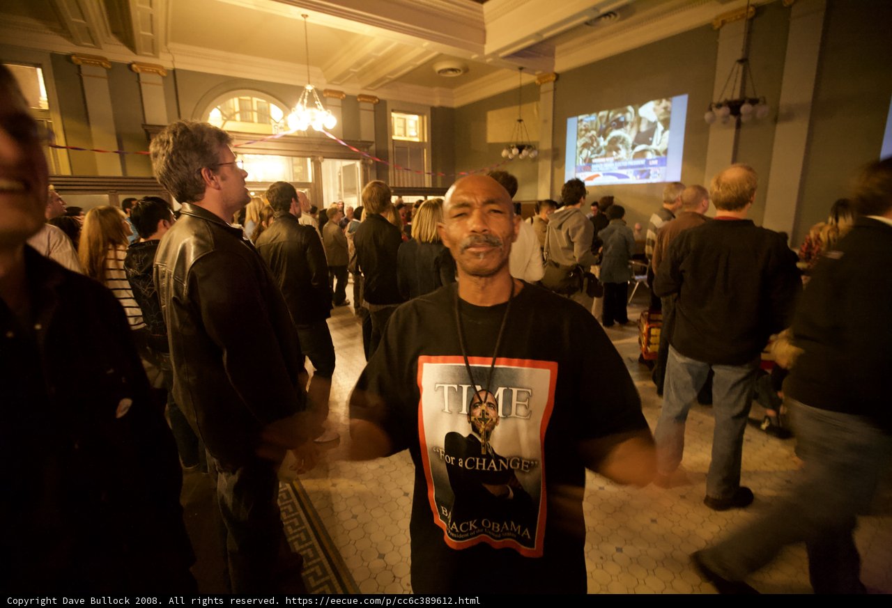 Barack Obama Watches Election Results on Screen in Crowded Room