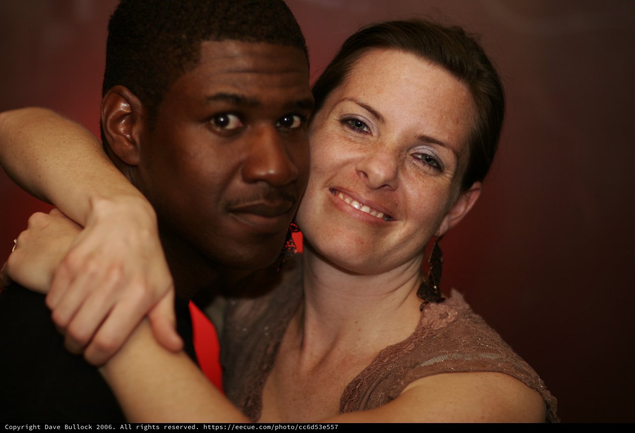 Couple Embracing at Evening Dance Event