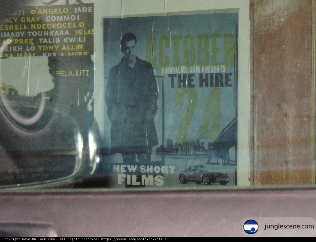 Accelerated the Hire" Movie Poster in Car Window