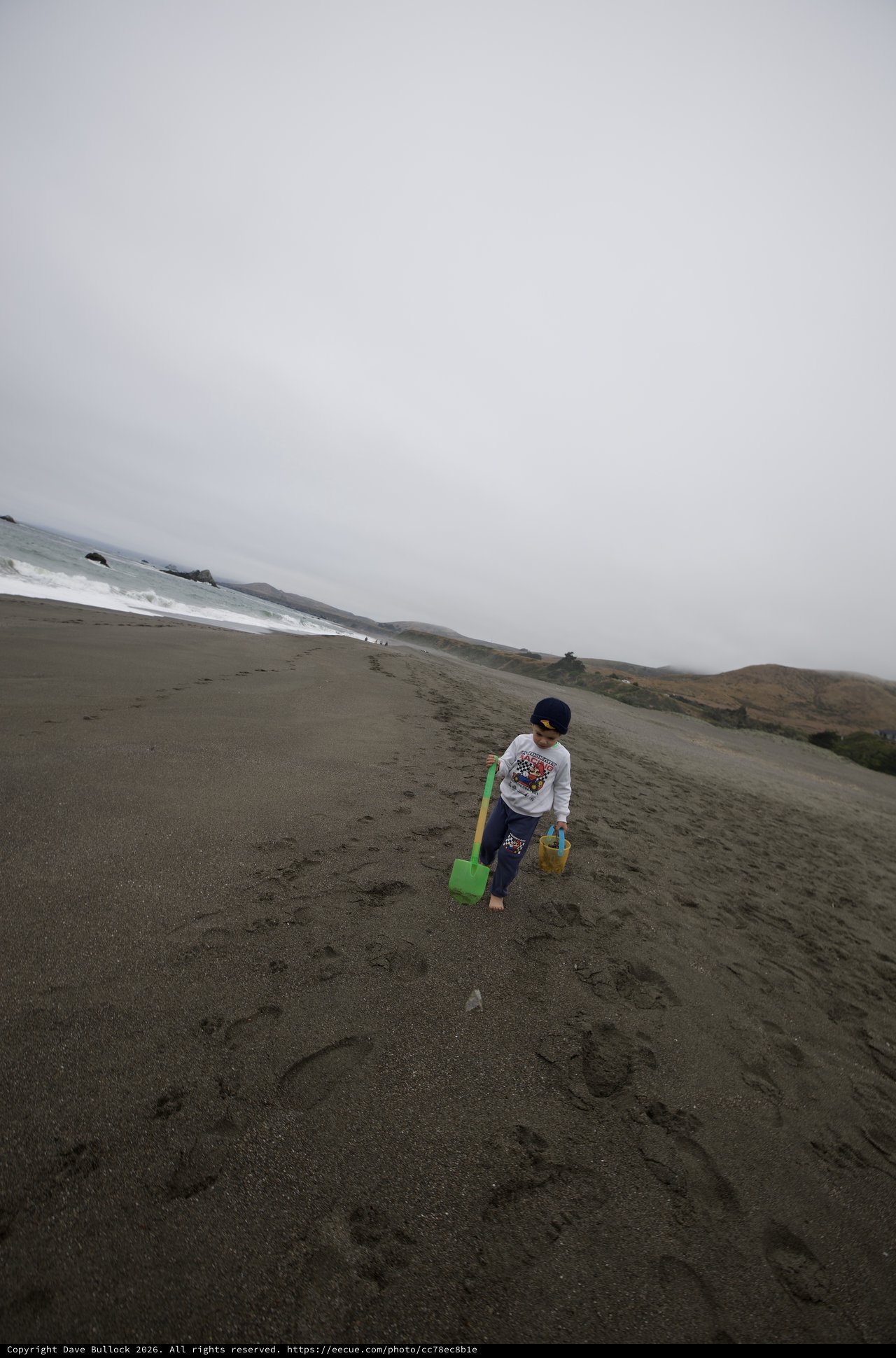 Young Explorer Walking Along Foggy Northern California Beach