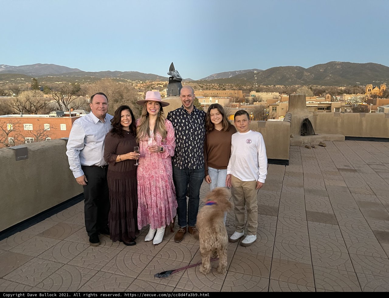 Family Fun on a Rooftop with Their Furry Friend