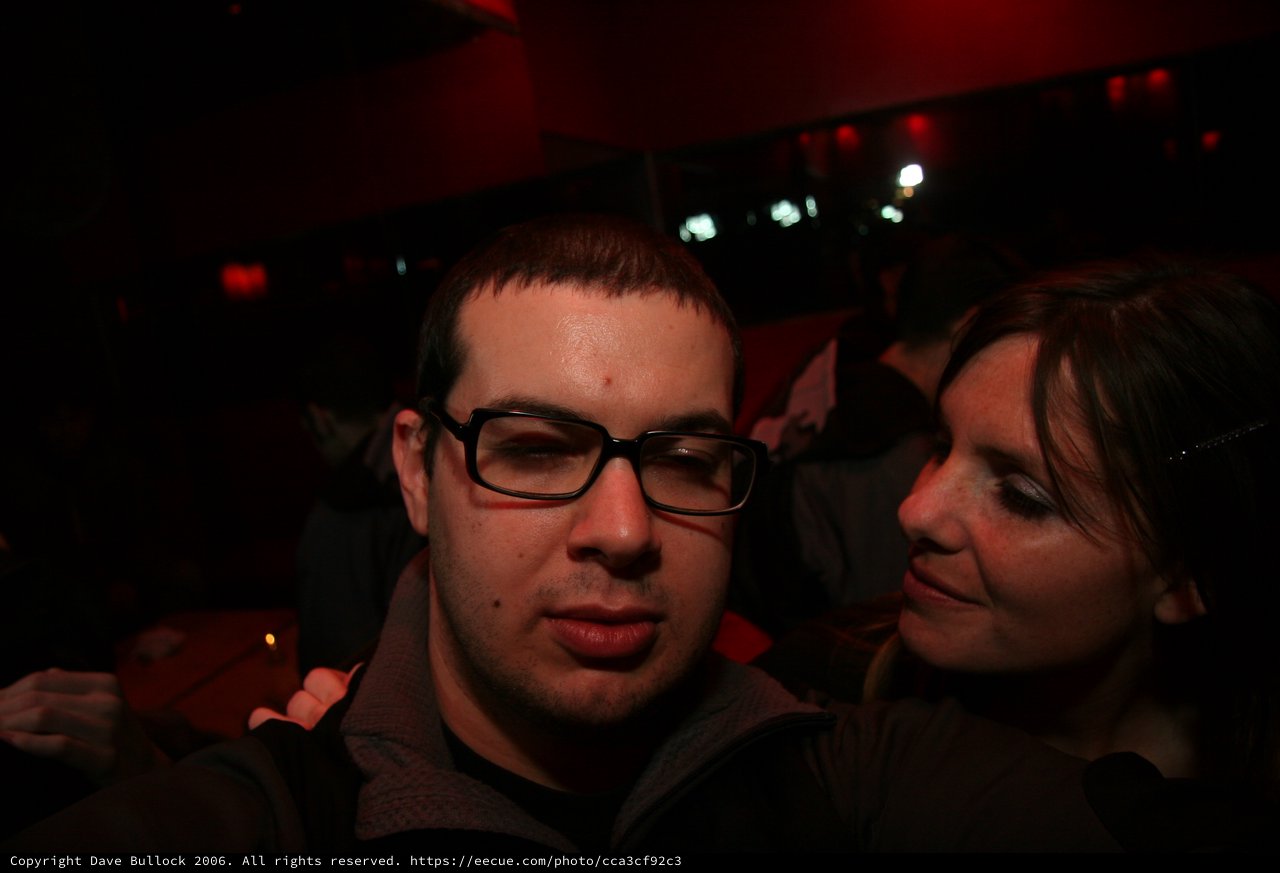 Two Friends Share a Moment at a Nightclub