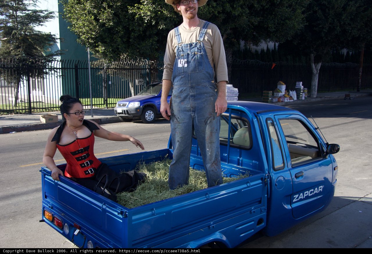 Man standing on top of a pickup truck