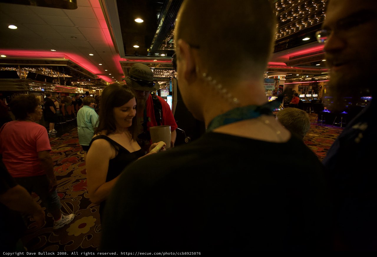 Friends Socializing Inside a Bustling Casino Floor