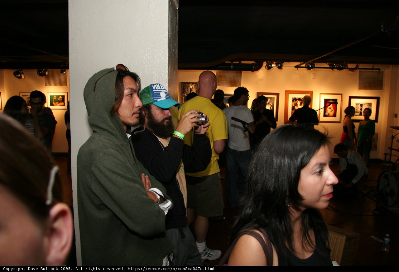 A Crowd of Hat-Wearing Art Lovers
