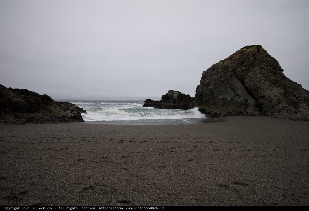 Moody Coastal Cove Framed by Ancient Sea Rocks