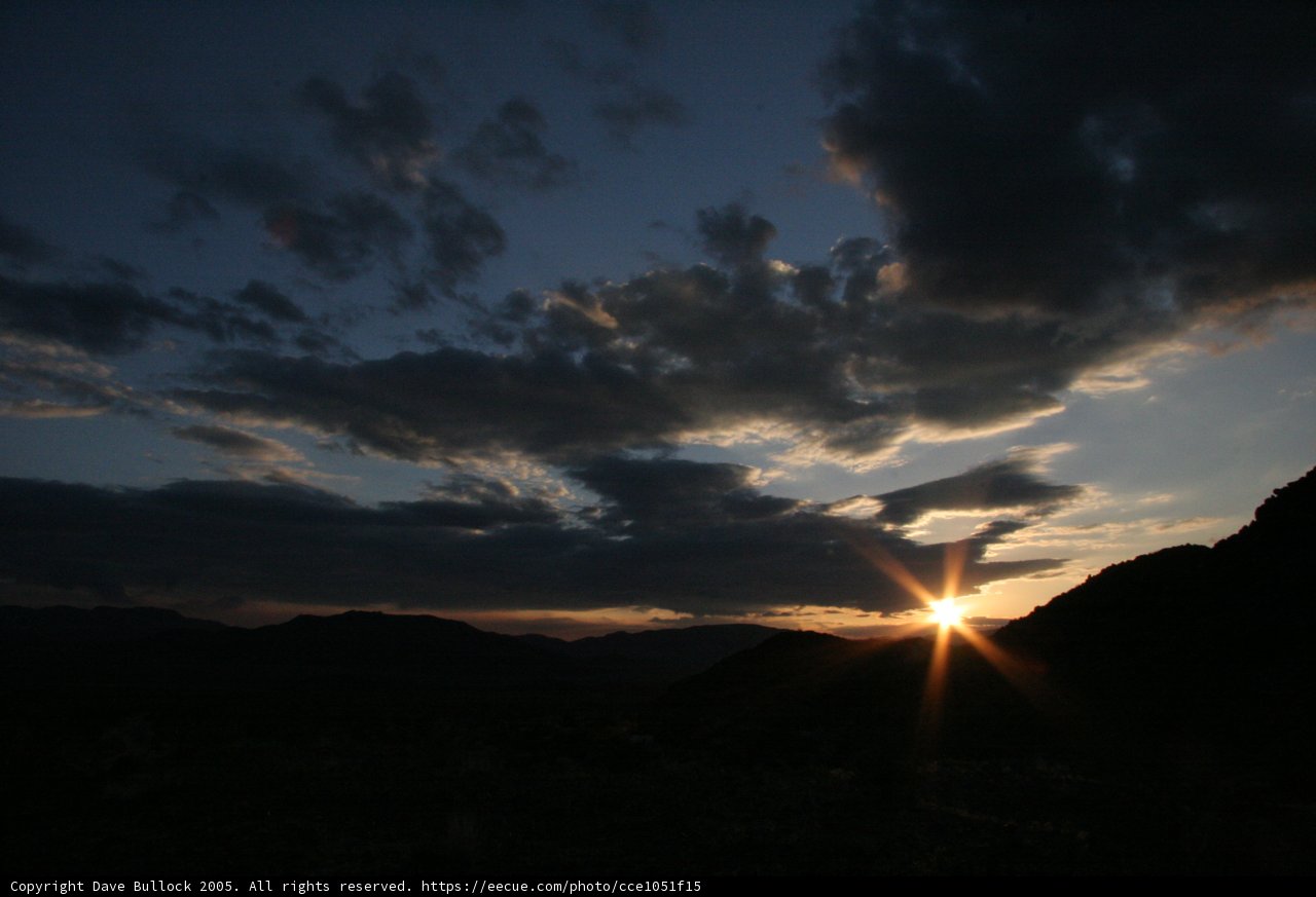 Setting Sun's Glory over Dark Skies