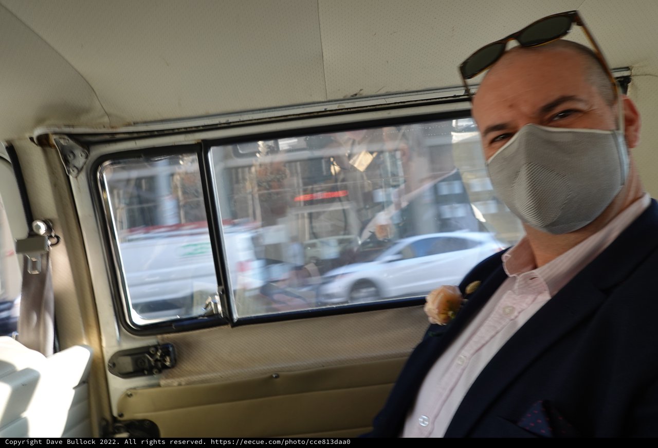 Masked Man Traveling in Moving Vehicle