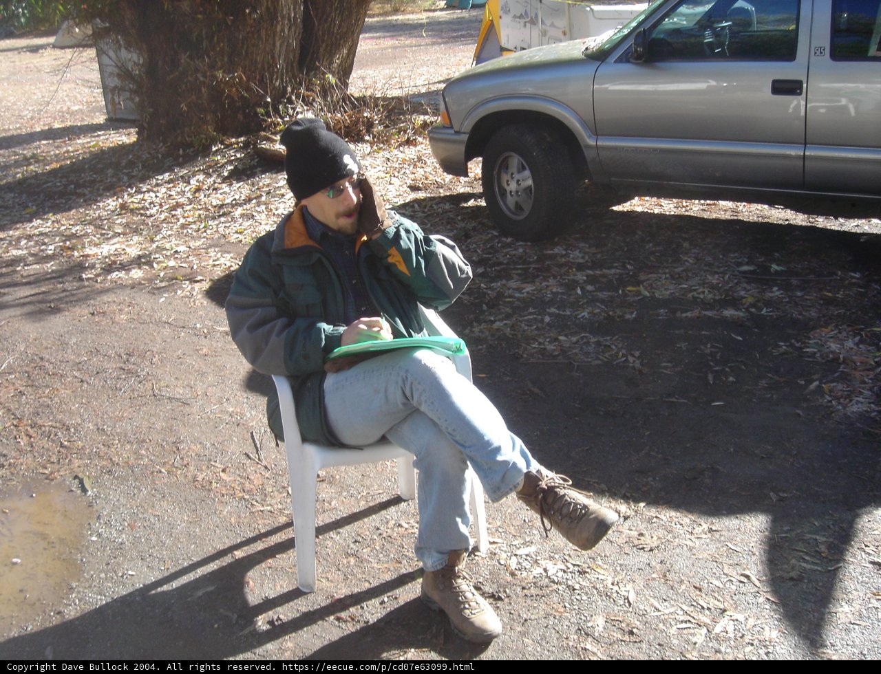 Spokes and Sitting: Man Contemplates Awaiting Adventure