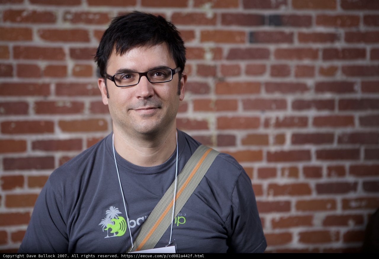 The Happy Man in Black Glasses