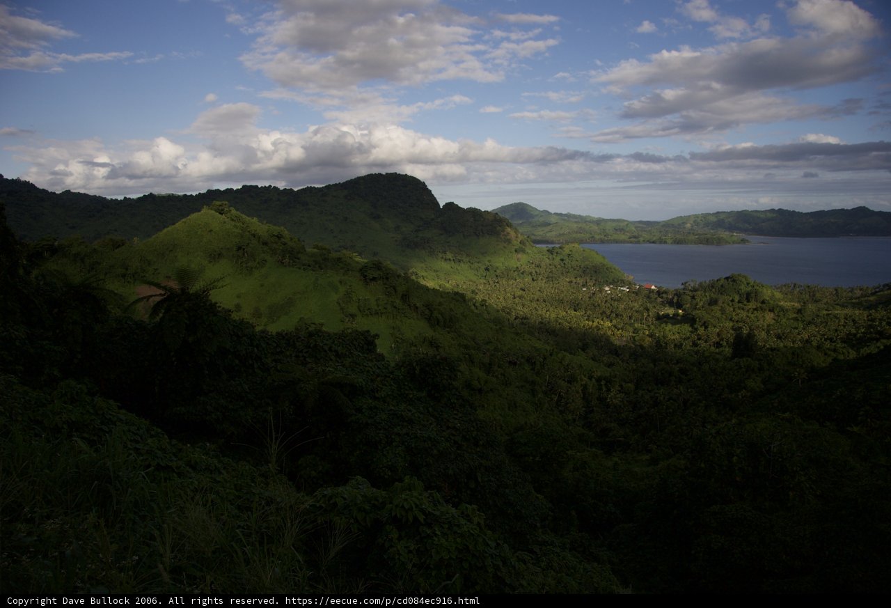 Hilltop View of Majestic Mountains and Water