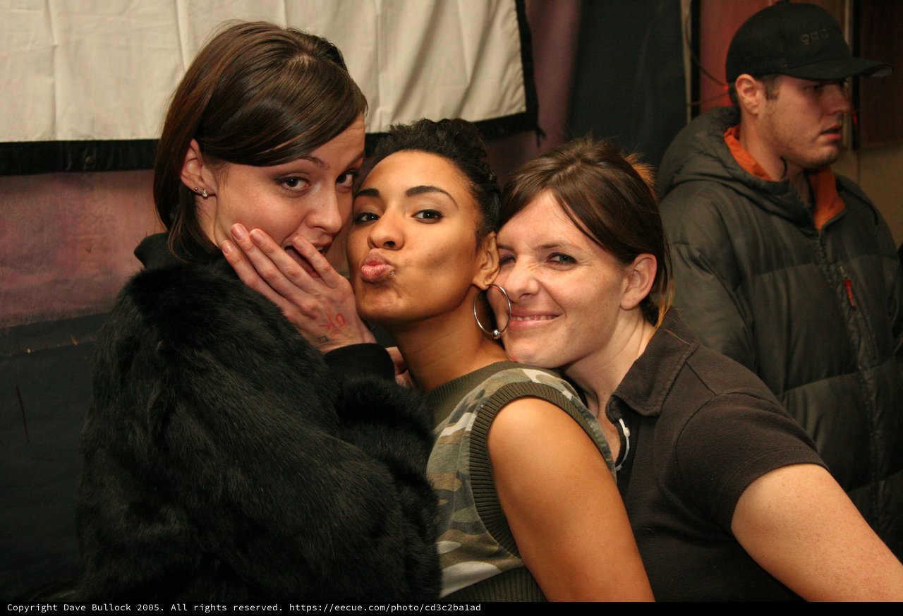 Three Friends Celebrate at a Nightclub Party