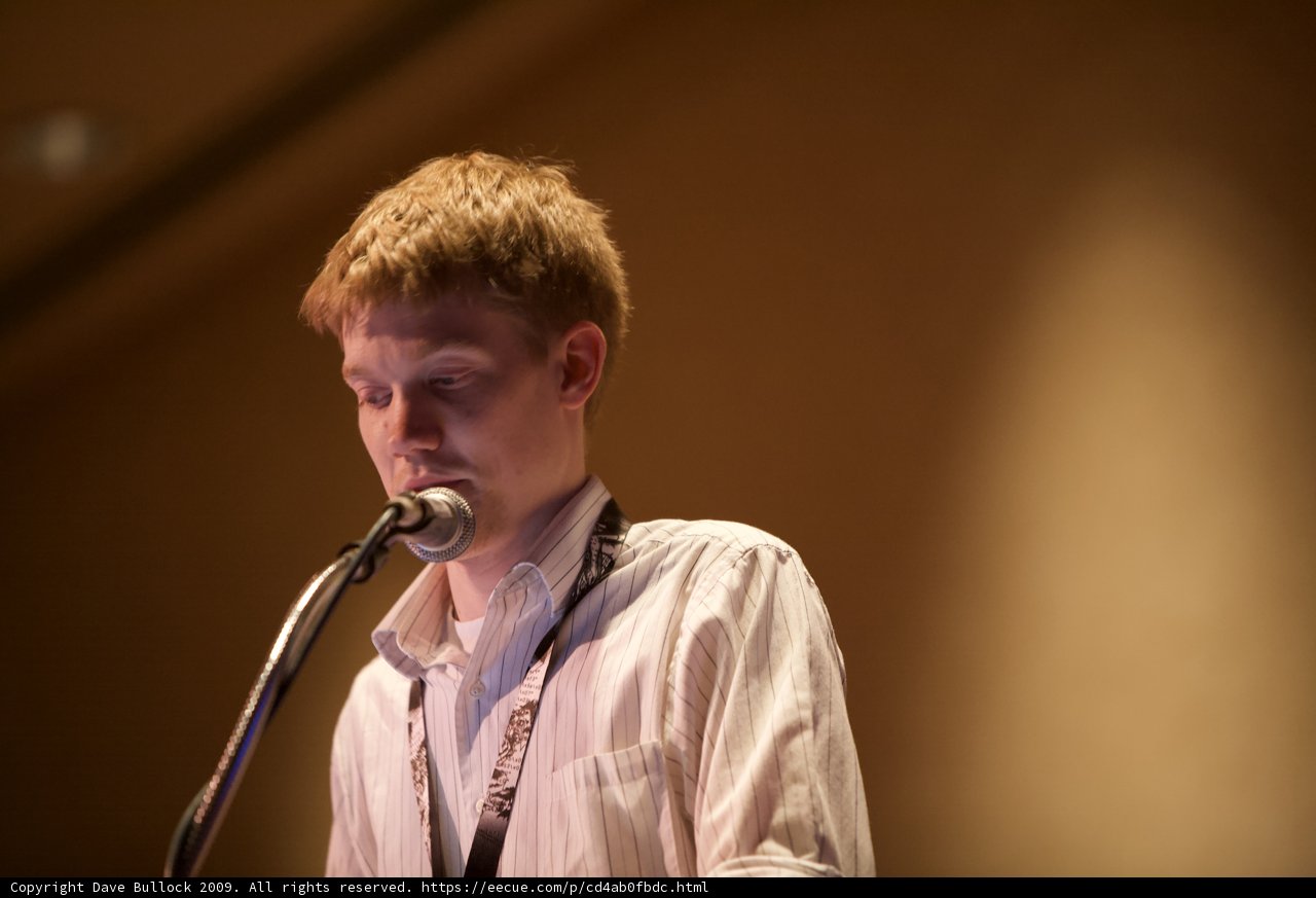 Solo Performance: Young Man Sings into Microphone