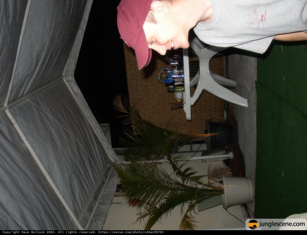 Man in Hat with Potted Plant