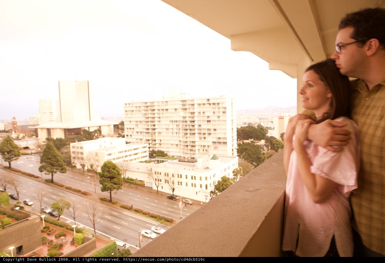 New Parents on Hotel Balcony Overlooking San Francisco