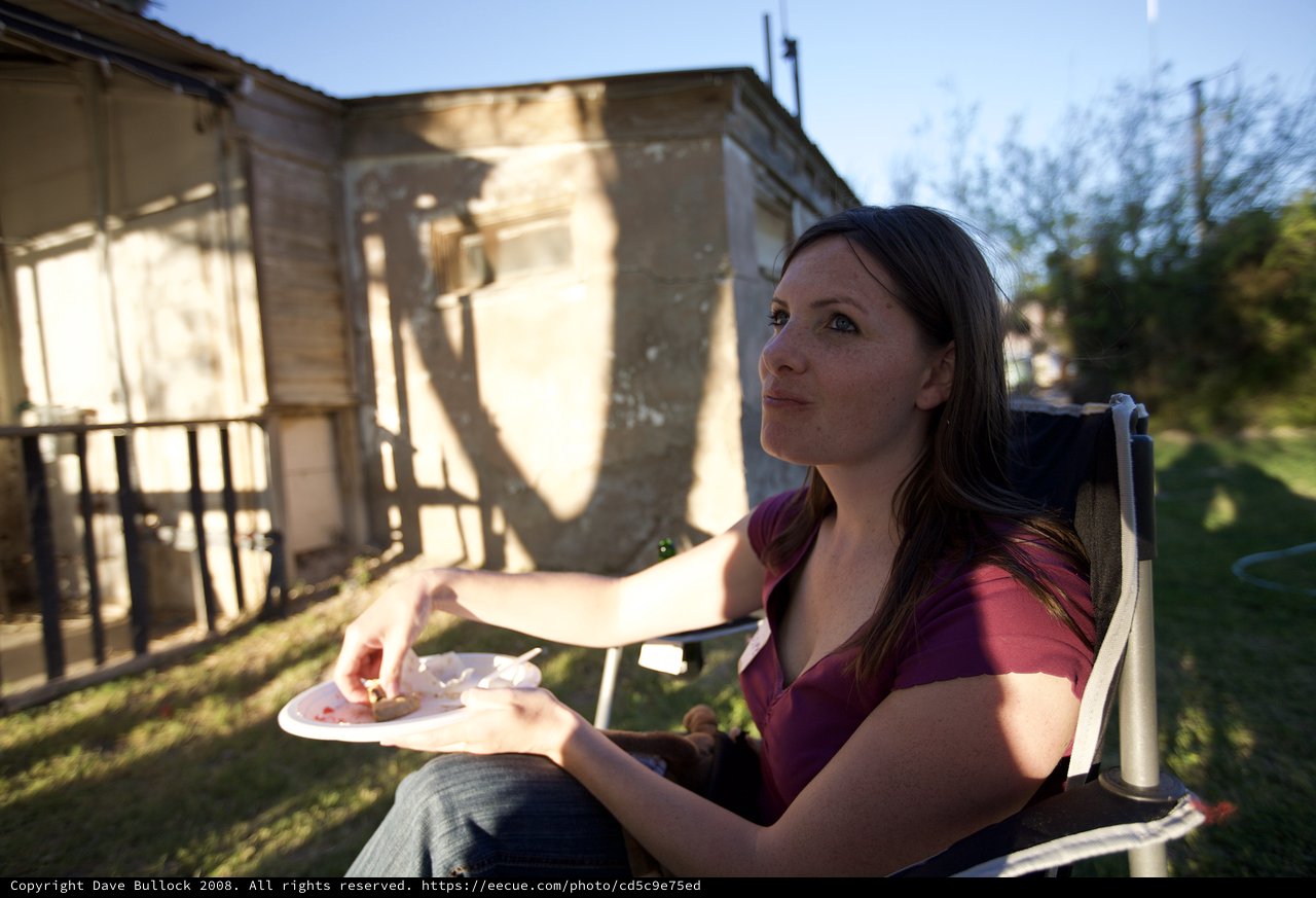 Woman Relaxing Outdoors at Desert Backyard Gathering
