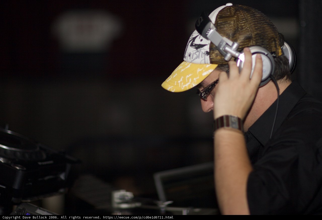 Man in Black Shirt Wearing Headphones and Microphone