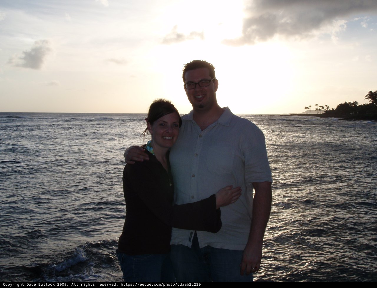 Couple Embracing at Tropical Sunset Oceanfront