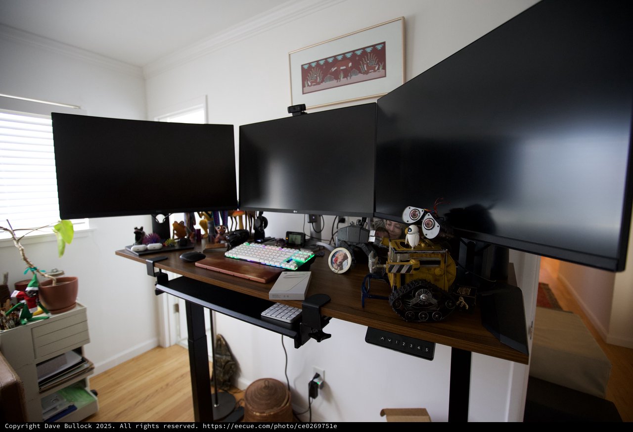 Multi-Monitor Standing Desk Workstation with Collectibles