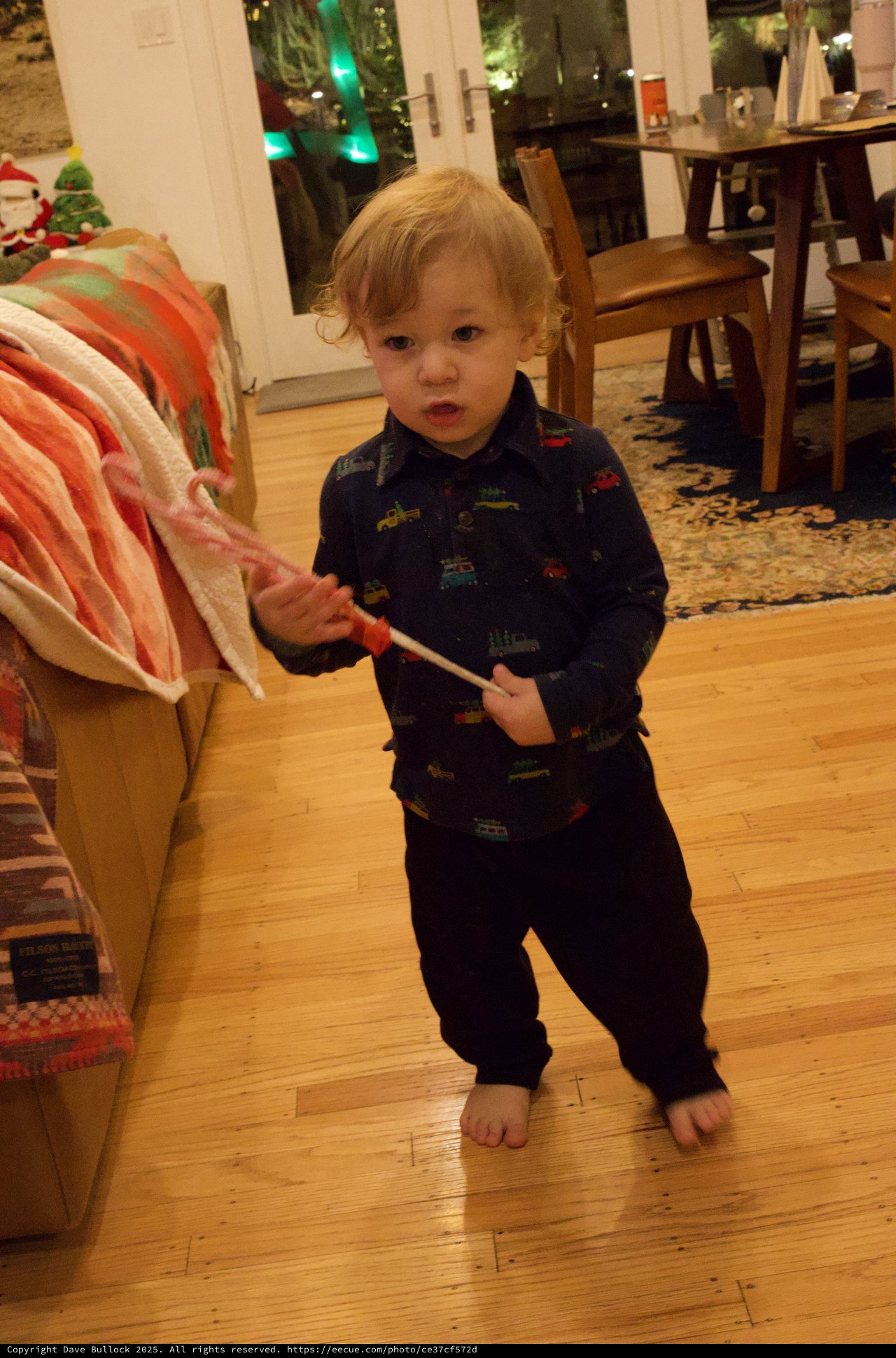Toddler with Candy Cane on Christmas Morning