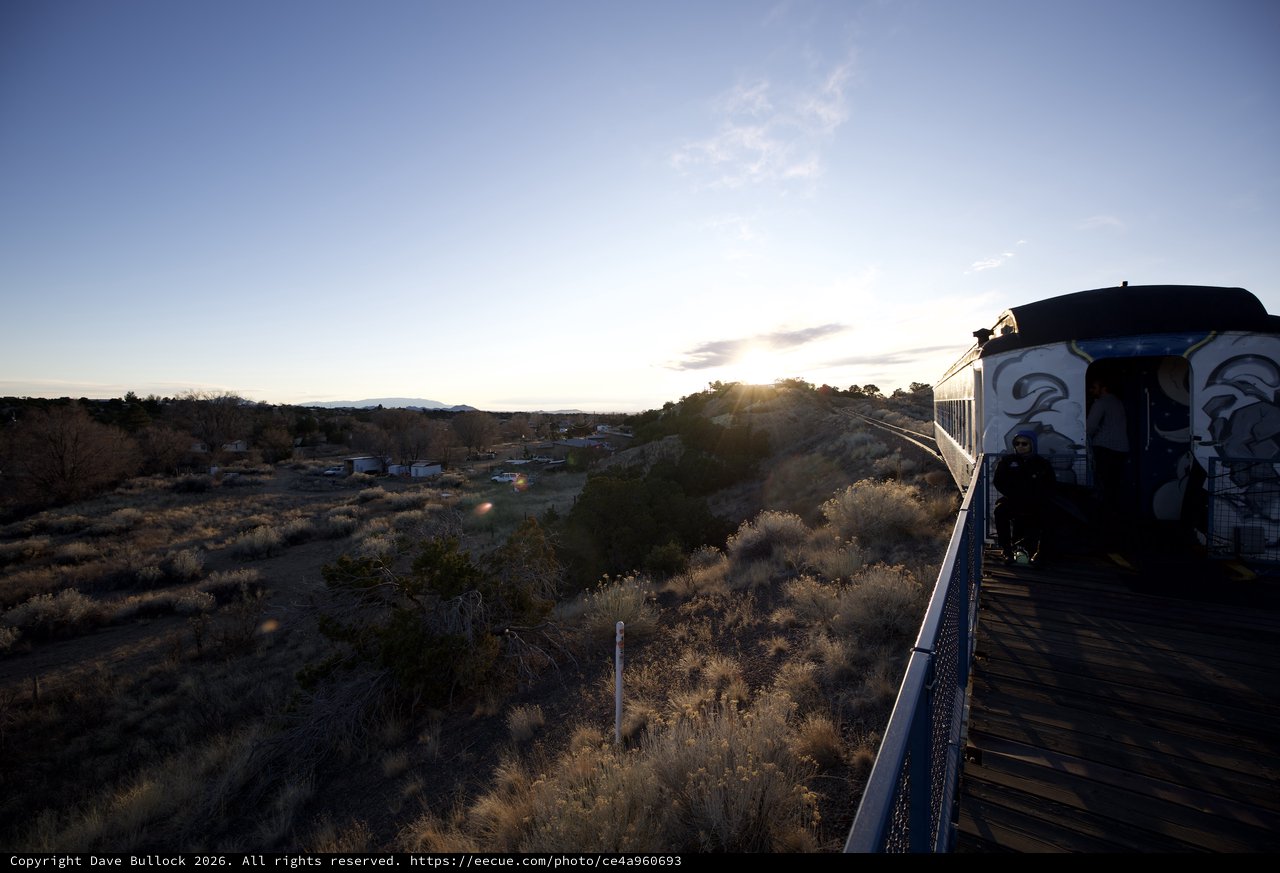 Sunset Train Journey Through Desert Landscape