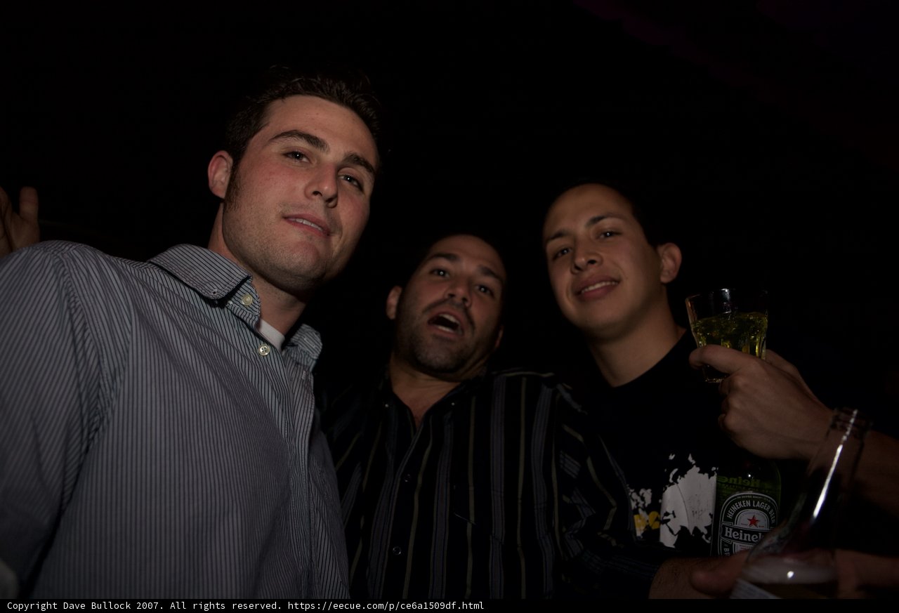 Three Men Toast to a Night of Fun at the Club