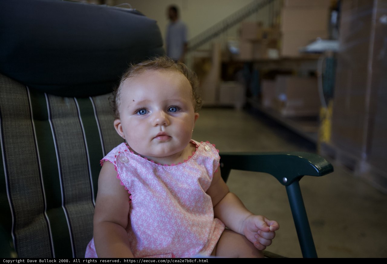 Tiny Tot Takes a Seat in a Warehouse