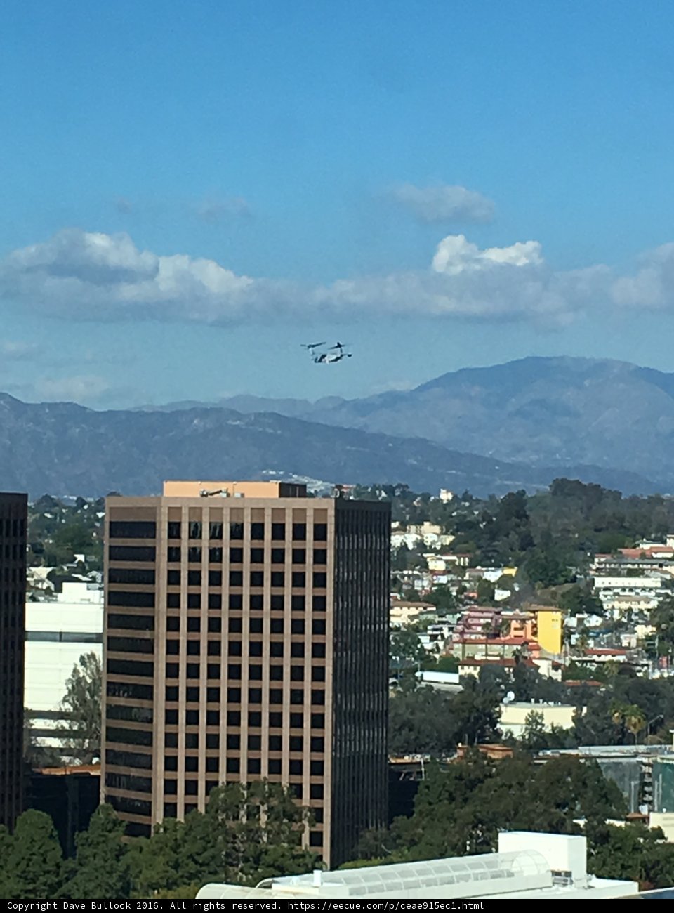 Flying Over The City With Mountains