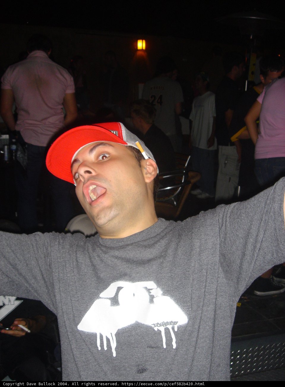 Grey Shirted Man in a Baseball Cap