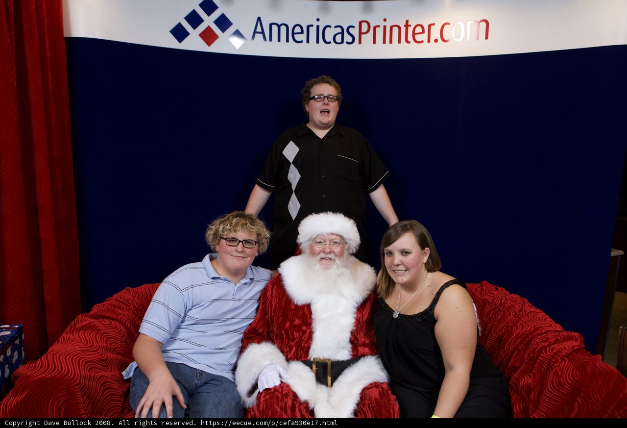 Santa Claus Strikes a Pose with Three Guests at 2008 APC Xmas Party