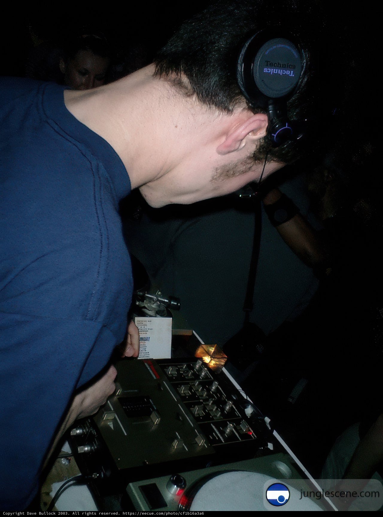 DJ Rocks the Party with a Laptop and Headphones