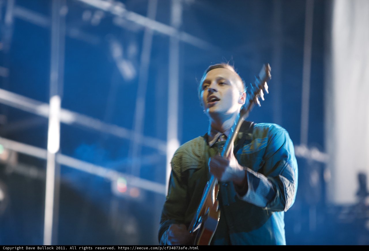 Win Butler Rocks the Stage with his Electric Guitar
