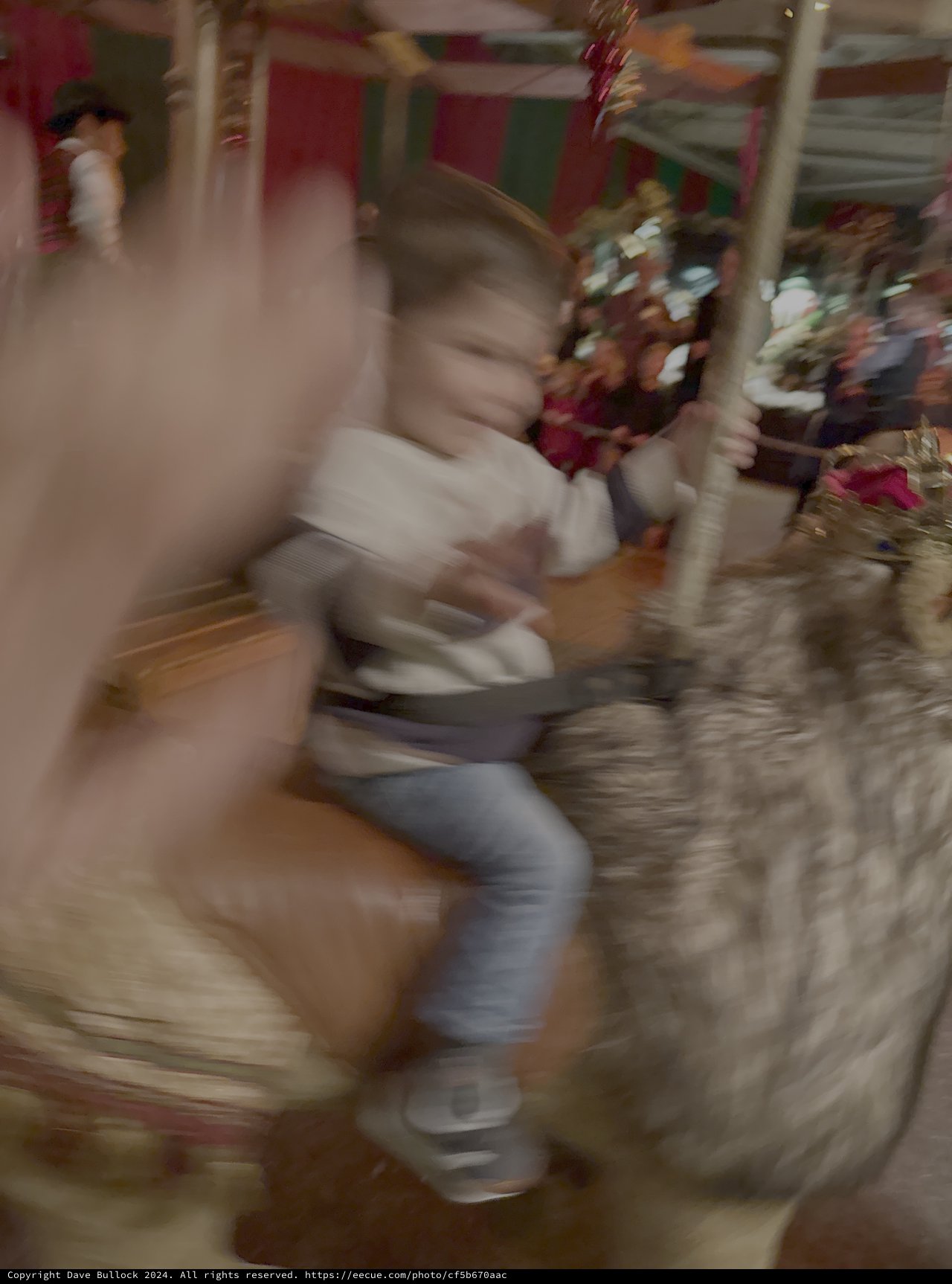 Motion Blur Child on Carnival Carousel Ride