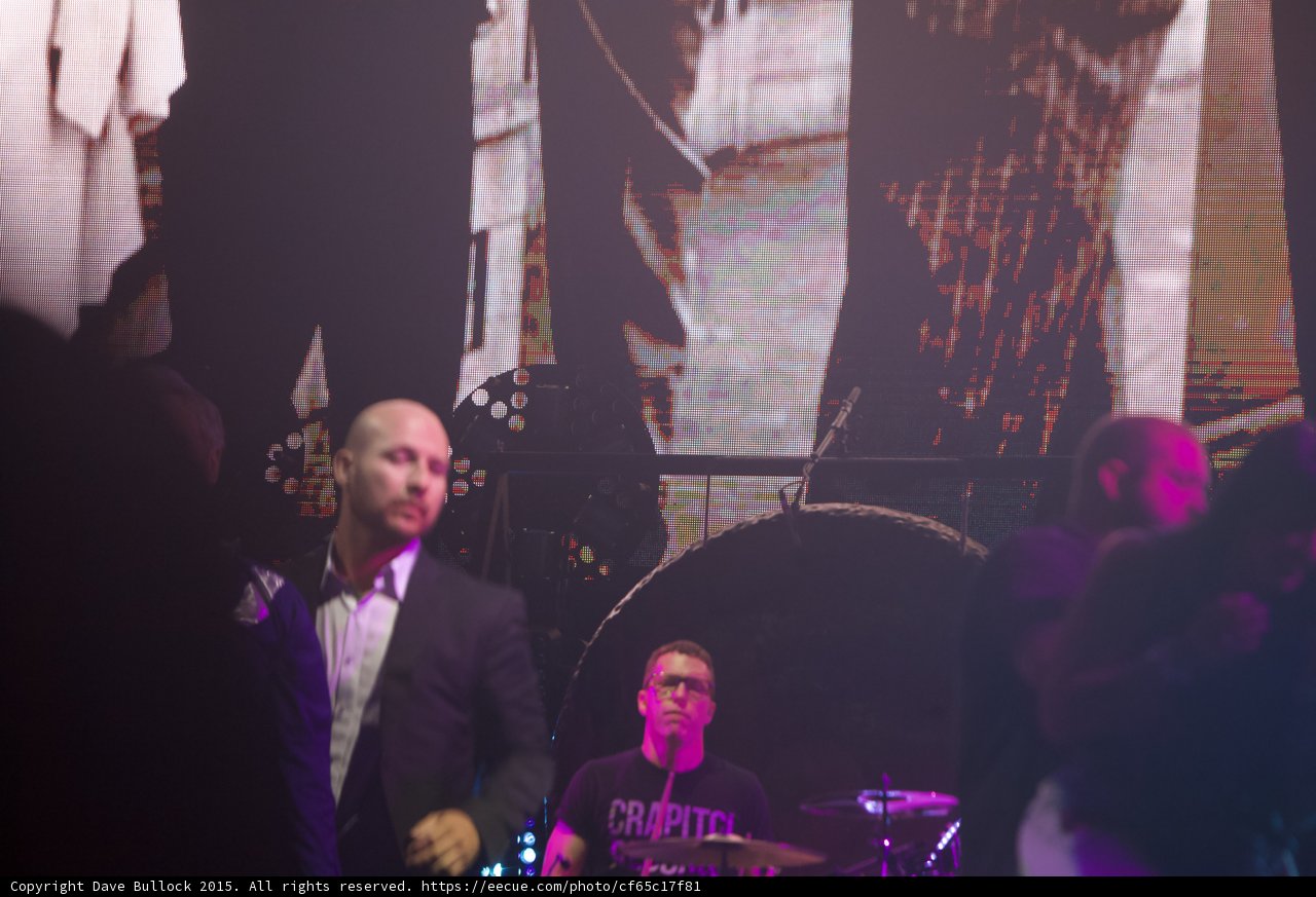Security Guard Suit Foreground Drummer Glasses Capitol Tee Gong Smiths Imagery Video Screen Stage